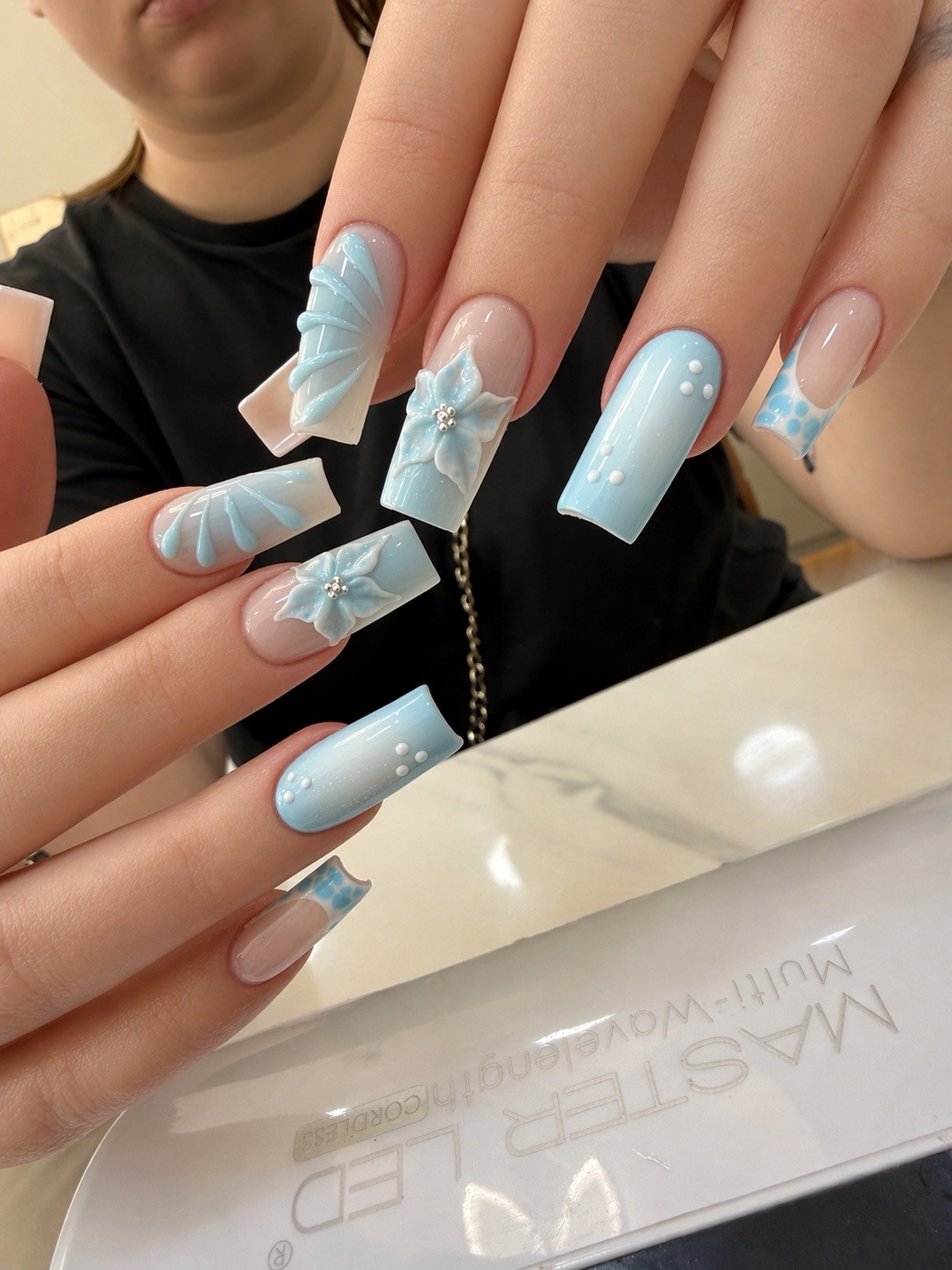 Blue porcelain 3D nails at Chloe Nail Spa